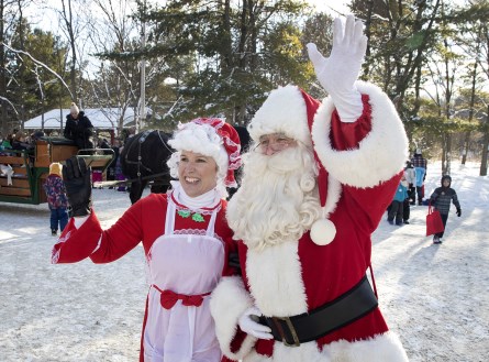 Santa and Mrs. Claus waving to visitors to Christmas at Ken Reid