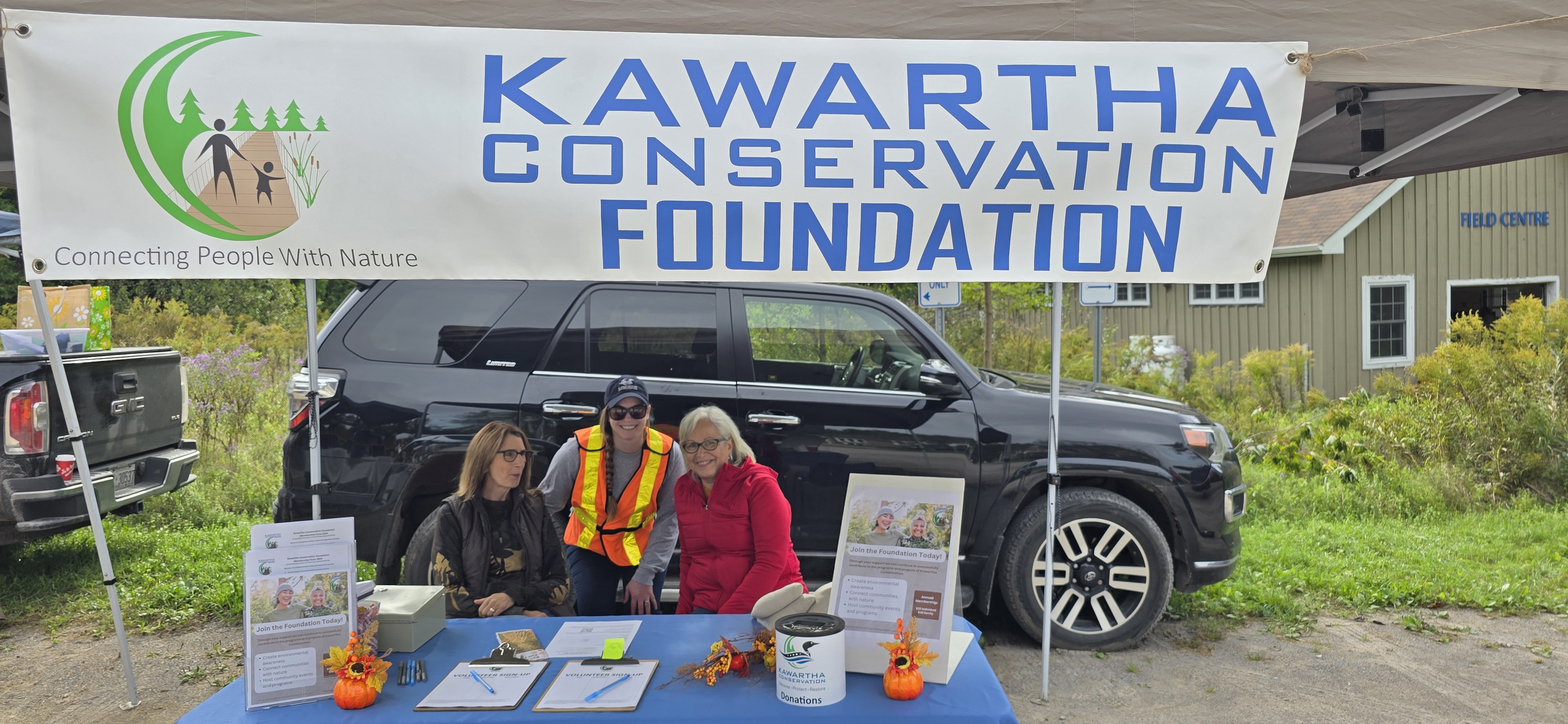 Members of the Kawartha Conservation Foundation with a membership booth at the Kawartha Fall Festival.