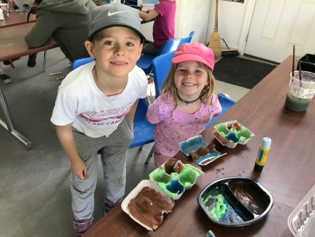 Boy and girl smiling doing crafts Boy and girl smiling doing crafts